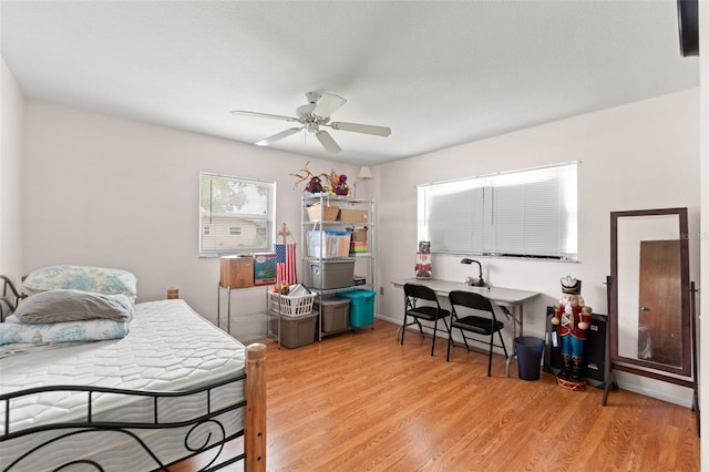 9171 Horizon Dr, Spring Hill, FL 34608 - bedroom with light wood finished floors and a ceiling fan