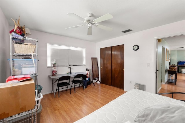 9171 Horizon Dr, Spring Hill, FL 34608 - bedroom featuring wood finished floors, a closet, and ceiling fan