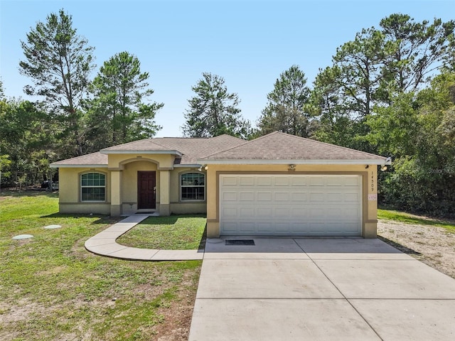 14509 Mayer Ave, Hudson, FL 34669 - single story home featuring stucco siding, driveway, a garage, and a front lawn