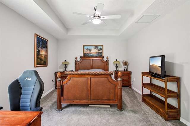 14509 Mayer Ave, Hudson, FL 34669 - carpeted bedroom featuring a raised ceiling, an office area, and a ceiling fan