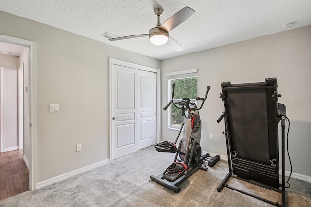 14509 Mayer Ave, Hudson, FL 34669 - workout area with a ceiling fan, carpet, and a textured ceiling