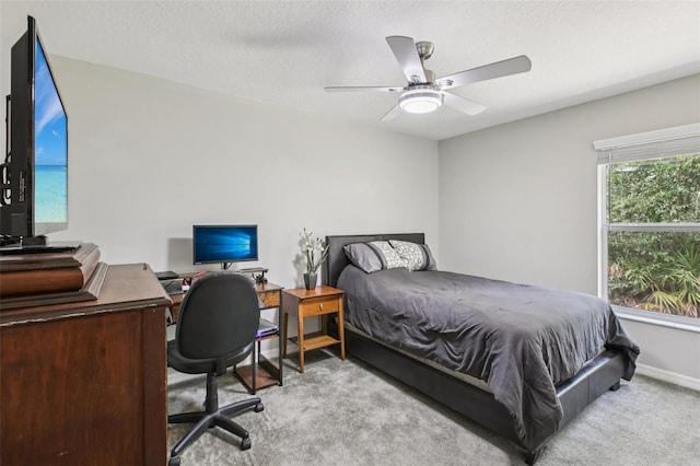 14509 Mayer Ave, Hudson, FL 34669 - carpeted bedroom with a ceiling fan and an office area