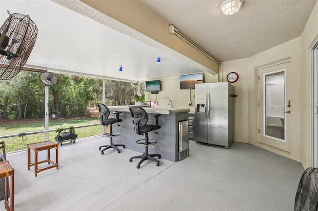 14509 Mayer Ave, Hudson, FL 34669 - home office with finished concrete flooring and a textured ceiling
