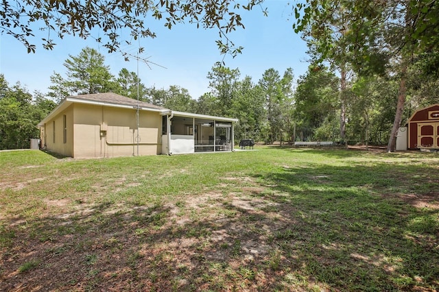 14509 Mayer Ave, Hudson, FL 34669 - view of green lawn with a sunroom and a storage shed