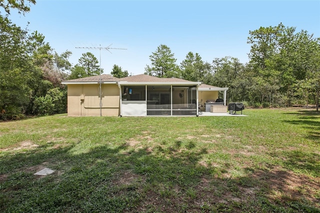 14509 Mayer Ave, Hudson, FL 34669 - back of property featuring a sunroom and a lawn