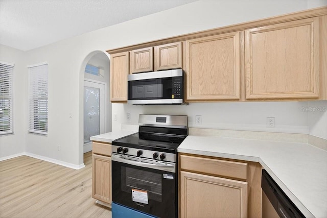 1760 Mountclair Ct, Mount Dora, FL 32757 - kitchen featuring appliances with stainless steel finishes, light brown cabinetry, and light wood finished floors
