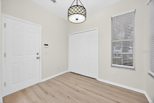 1760 Mountclair Ct, Mount Dora, FL 32757 - foyer entrance with wood finished floors and baseboards