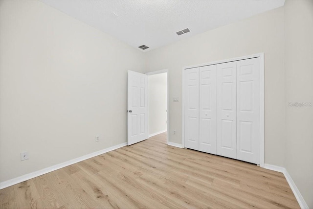 1760 Mountclair Ct, Mount Dora, FL 32757 - unfurnished bedroom featuring light wood finished floors and a closet