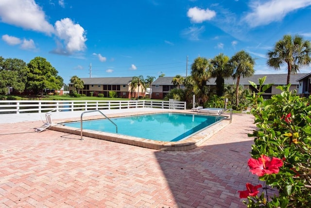 200 Country Club Dr Unit 1402, Largo, FL 33771 - community pool featuring a patio