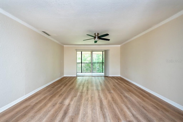 200 Country Club Dr Unit 1402, Largo, FL 33771 - empty room featuring wood finished floors, ceiling fan, and crown molding