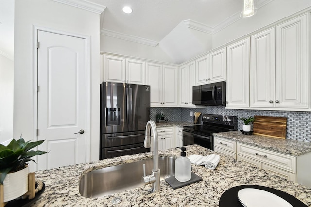 2405 W N B St Unit 1, Tampa, FL 33609 - kitchen with black appliances, crown molding, backsplash, white cabinetry, and recessed lighting