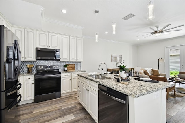 2405 W N B St Unit 1, Tampa, FL 33609 - kitchen featuring freestanding refrigerator, dishwasher, electric range oven, ornamental molding, and backsplash