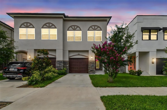 2405 W N B St Unit 1, Tampa, FL 33609 - view of front of house featuring driveway, an attached garage, and stucco siding