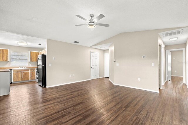 1421 Vinetree Dr, Brandon, FL 33510 - unfurnished living room with ceiling fan, dark wood-style flooring, and vaulted ceiling
