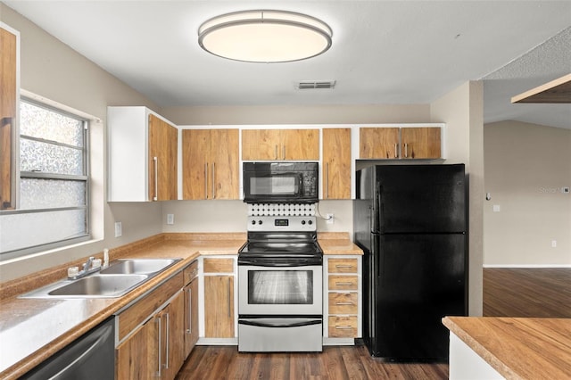 1421 Vinetree Dr, Brandon, FL 33510 - kitchen featuring black appliances, plenty of natural light, light countertops, and dark wood-style flooring