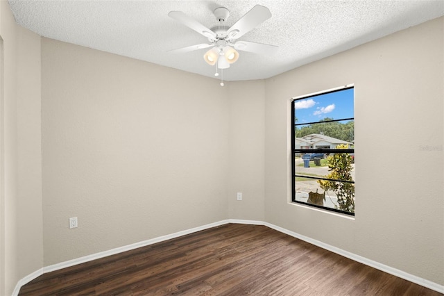 1421 Vinetree Dr, Brandon, FL 33510 - spare room with dark wood-style floors, a ceiling fan, and a textured ceiling