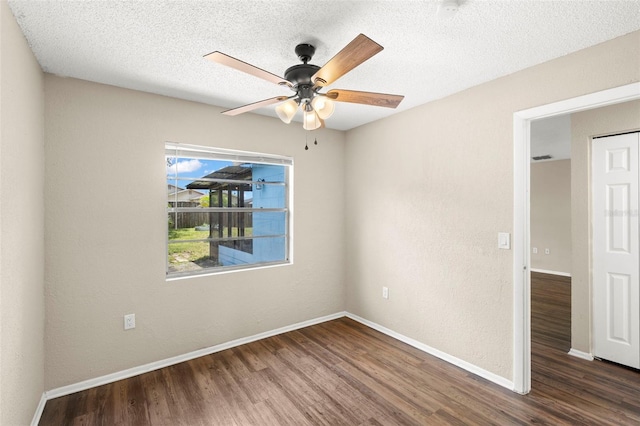 1421 Vinetree Dr, Brandon, FL 33510 - spare room featuring wood finished floors, a ceiling fan, and a textured ceiling