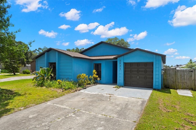 1421 Vinetree Dr, Brandon, FL 33510 - ranch-style house featuring an attached garage and concrete driveway