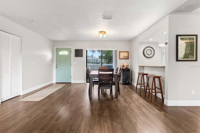 200 Gretchen Ct, Oldsmar, FL 34677 - dining space with dark wood-style flooring
