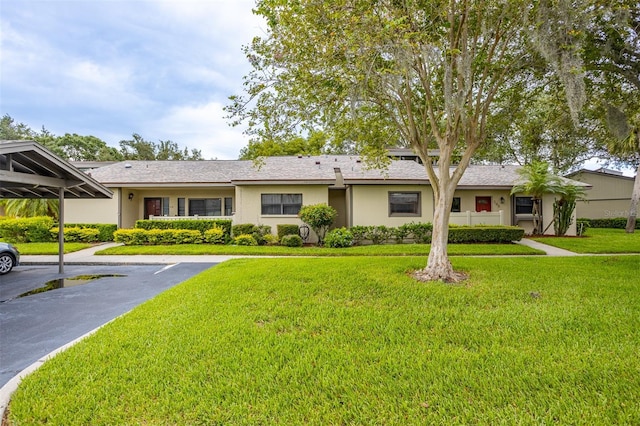 200 Gretchen Ct, Oldsmar, FL 34677 - single story home featuring covered and uncovered parking, a front lawn, and stucco siding