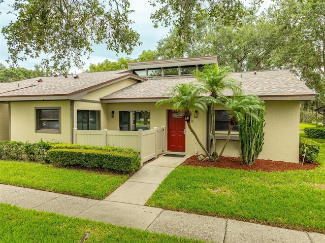 200 Gretchen Ct, Oldsmar, FL 34677 - view of front of house featuring roof with shingles and stucco siding