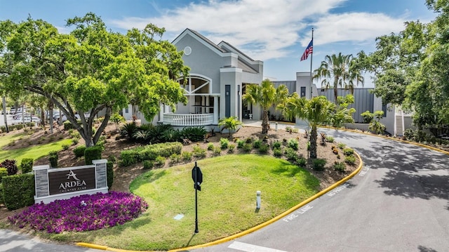 200 Gretchen Ct, Oldsmar, FL 34677 - view of front of house with asphalt driveway, stucco siding, and a front yard