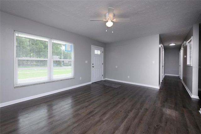 5018 Pine St, Seffner, FL 33584 - unfurnished living room with dark wood-style floors, a ceiling fan, and a textured ceiling