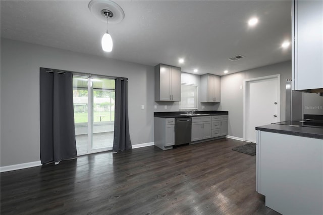 5018 Pine St, Seffner, FL 33584 - kitchen with stainless steel dishwasher, dark countertops, dark wood-type flooring, black electric stovetop, and recessed lighting