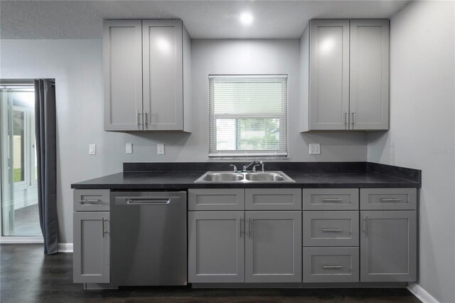 5018 Pine St, Seffner, FL 33584 - kitchen with dishwasher, dark countertops, and gray cabinets