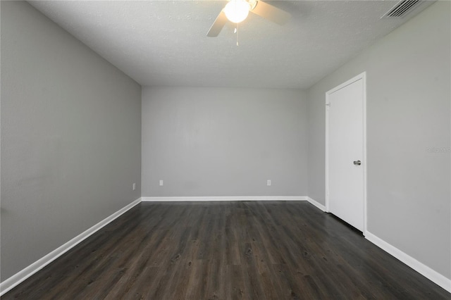 5018 Pine St, Seffner, FL 33584 - spare room with dark wood-style flooring, a ceiling fan, and a textured ceiling