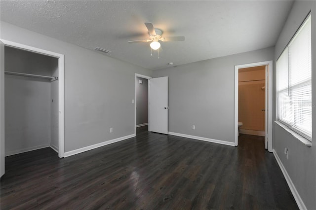 5018 Pine St, Seffner, FL 33584 - unfurnished bedroom featuring dark wood-type flooring, a closet, and ceiling fan