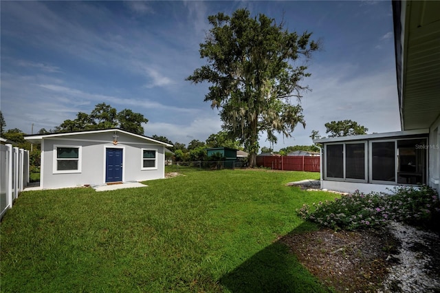 5018 Pine St, Seffner, FL 33584 - fenced backyard with a sunroom and an outdoor structure