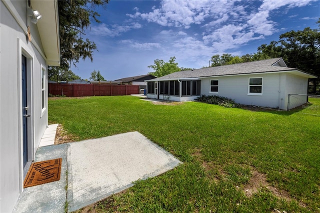 5018 Pine St, Seffner, FL 33584 - fenced backyard featuring a sunroom and a patio area