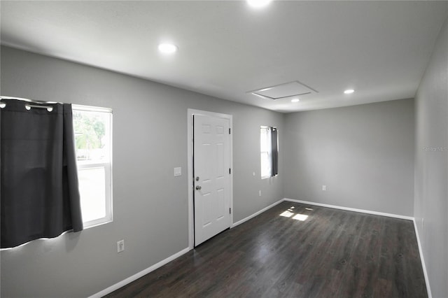 5018 Pine St, Seffner, FL 33584 - spare room featuring dark wood-style flooring, recessed lighting, and attic access