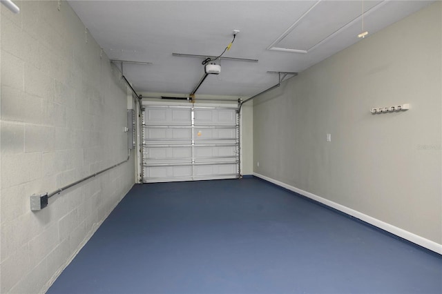 5018 Pine St, Seffner, FL 33584 - garage featuring a garage door opener, electric panel, and concrete block wall