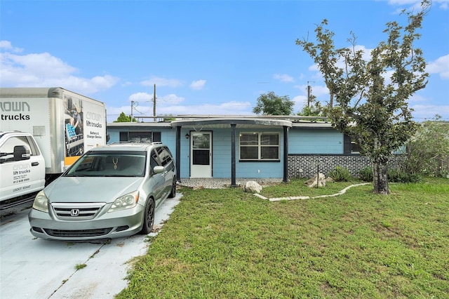 2149 Dixie Garden Loop, Holiday, FL 34690 - view of front of property featuring a front yard
