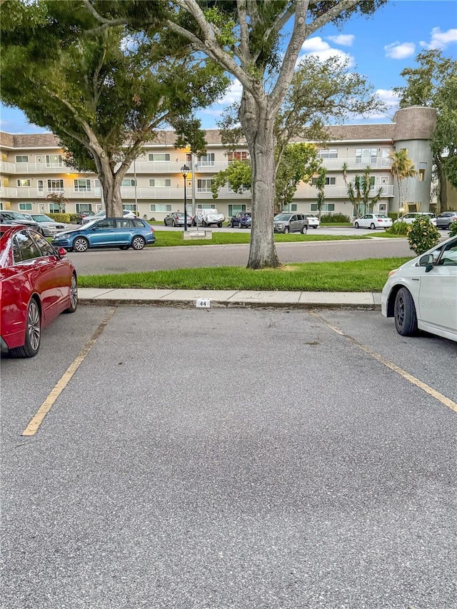 2460 Persian Dr Unit 44, Clearwater, FL 33763 - uncovered parking lot with a residential view