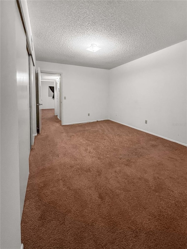 2460 Persian Dr Unit 44, Clearwater, FL 33763 - unfurnished room featuring a textured ceiling and light colored carpet