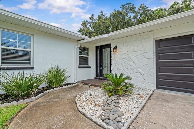 210 Lake Hobbs Rd, Lutz, FL 33548 - property entrance featuring stucco siding