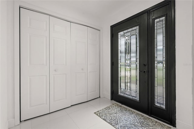 210 Lake Hobbs Rd, Lutz, FL 33548 - entryway with baseboards and light tile patterned floors
