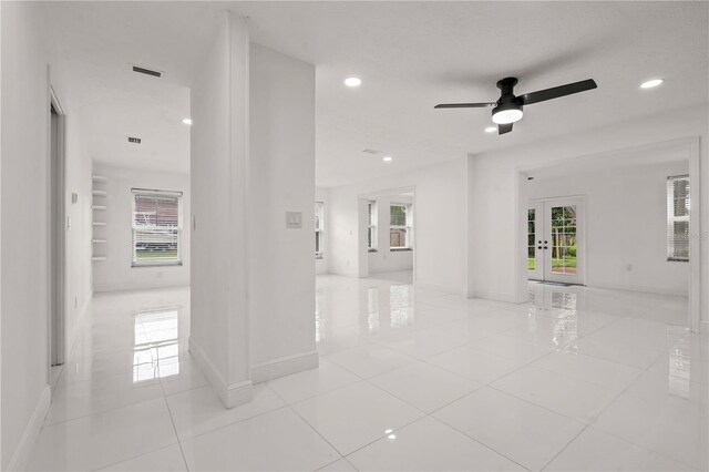 210 Lake Hobbs Rd, Lutz, FL 33548 - tiled empty room featuring plenty of natural light, french doors, ceiling fan, and recessed lighting