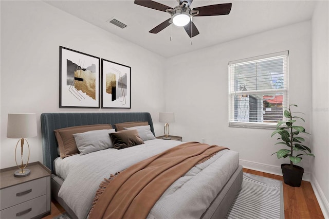 210 Lake Hobbs Rd, Lutz, FL 33548 - bedroom with wood finished floors and ceiling fan