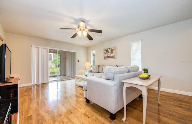 2206 Cordova Grn Unit 2206, Seminole, FL 33777 - living room with ceiling fan and light wood finished floors