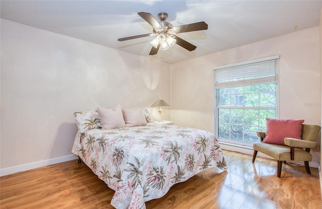 2206 Cordova Grn Unit 2206, Seminole, FL 33777 - bedroom with light wood-style flooring and ceiling fan