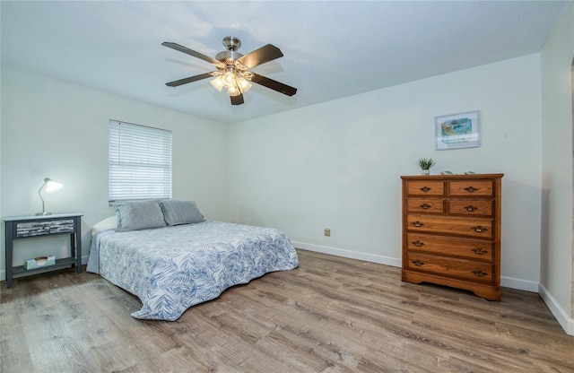 2206 Cordova Grn Unit 2206, Seminole, FL 33777 - bedroom featuring wood finished floors and a ceiling fan
