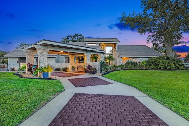6605 Seabird Way, Apollo Beach, FL 33572 - view of front of property with a front lawn, stone siding, and a porch