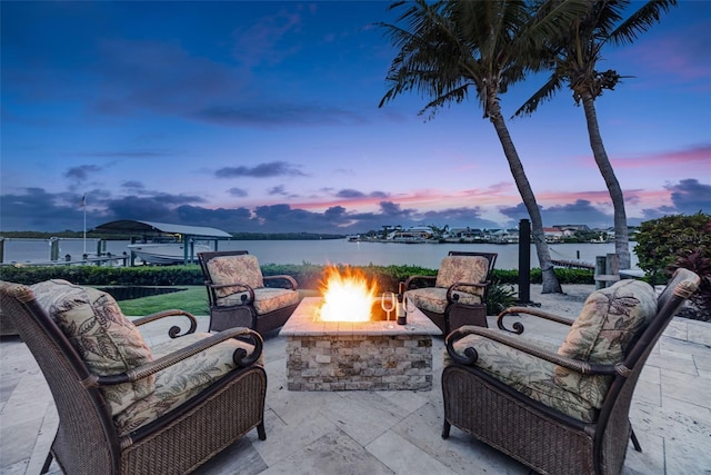 6605 Seabird Way, Apollo Beach, FL 33572 - view of patio with a water view and an outdoor living space with a fire pit