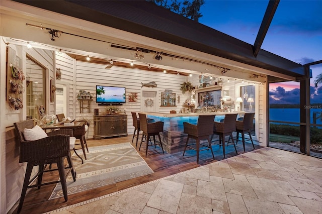 6605 Seabird Way, Apollo Beach, FL 33572 - view of patio / terrace featuring a bar, ceiling fan, and a lanai