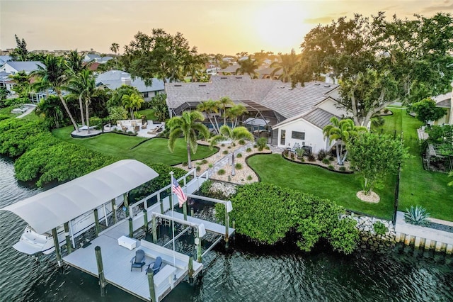 6605 Seabird Way, Apollo Beach, FL 33572 - dock area with boat lift, a water view, a yard, and a residential view