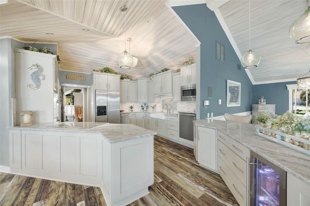 6605 Seabird Way, Apollo Beach, FL 33572 - kitchen with wine cooler, vaulted ceiling, stainless steel appliances, wood ceiling, and a peninsula